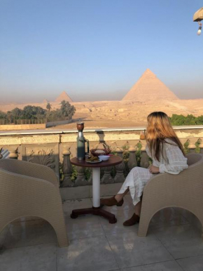 Sphinx palace pyramids view inn